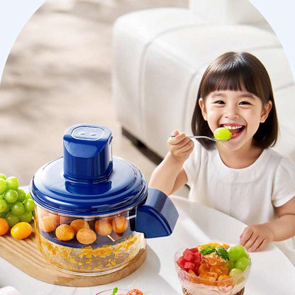 Child eating a colorful fruit salad with a blue juicer in the foreground.