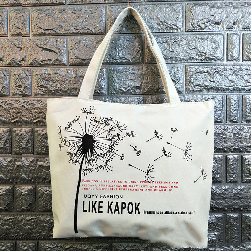Canvas shoulder bag with black dandelion illustration and “LIKE KAPOK” text