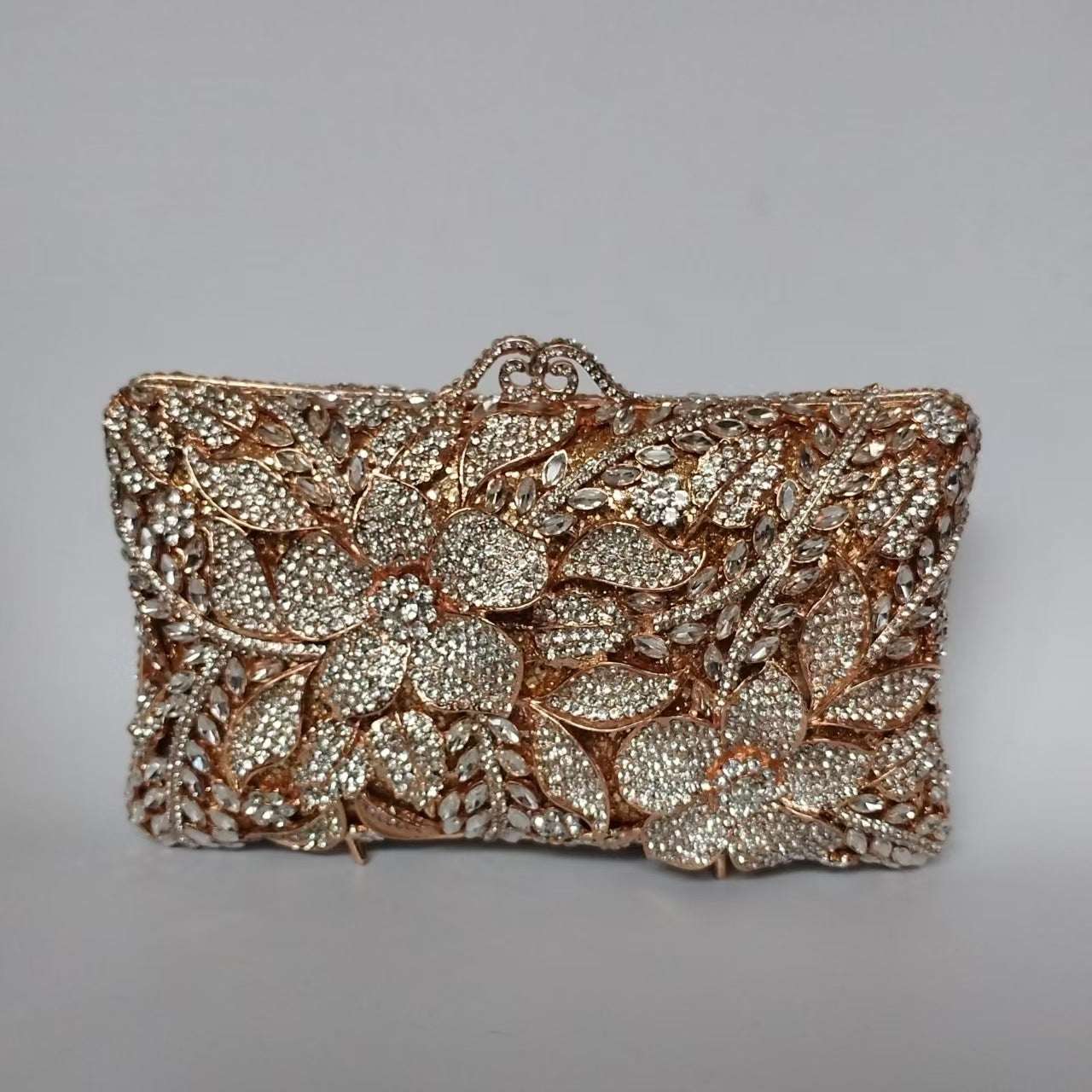 Champagne and silver-tone rhinestone floral clutch with beaded frame and top handle