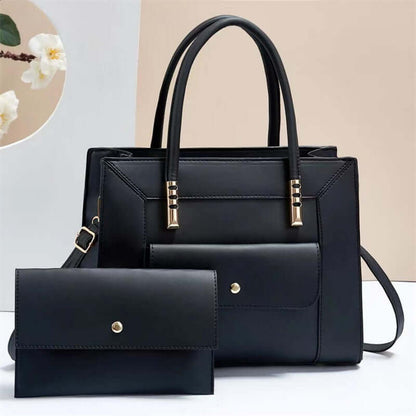 Dark navy tote bag set with top handles, shoulder strap, and matching mini crossbody bag