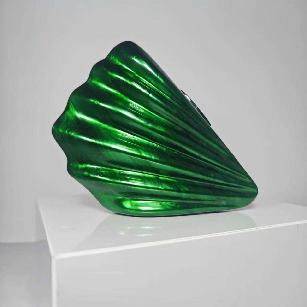 Metallic emerald green shell crossbody bag with glossy ridged design