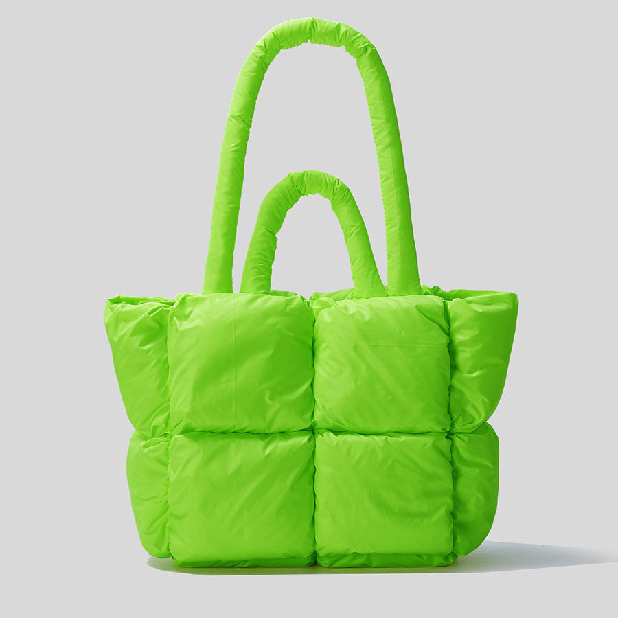 Puffer one-shoulder handbag in bright green with quilted panels and tall top handles