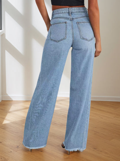 Women's light blue wide-leg denim pants, back view with belt loops and frayed hem.