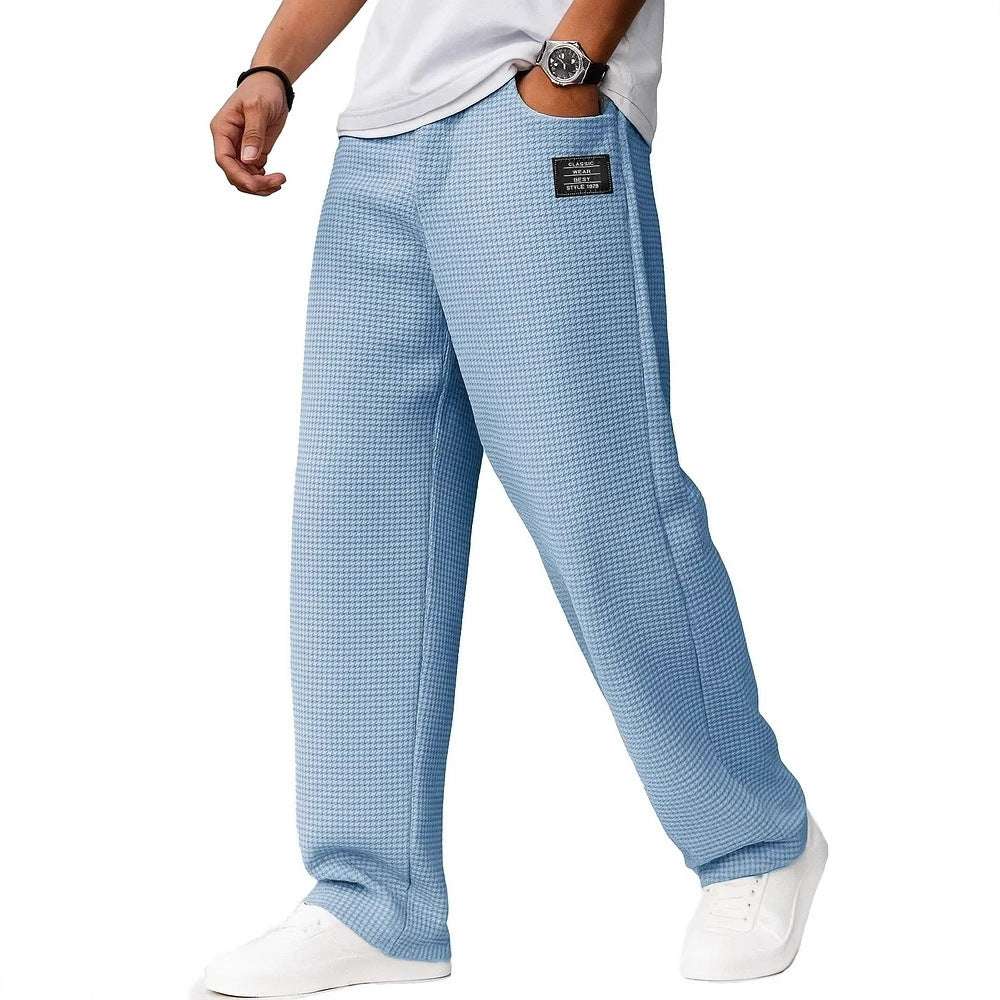 Light blue checkered pants worn by a person on a white background