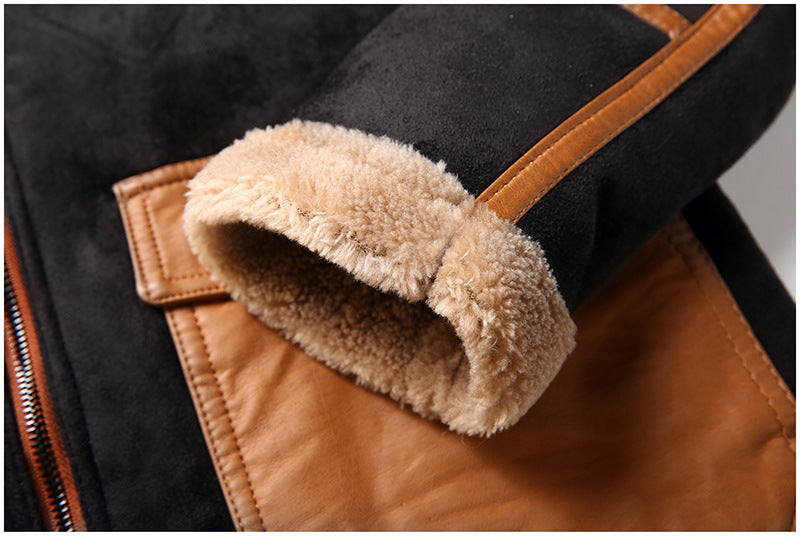 Close-up of a jacket with brown leather and beige fleece lining.