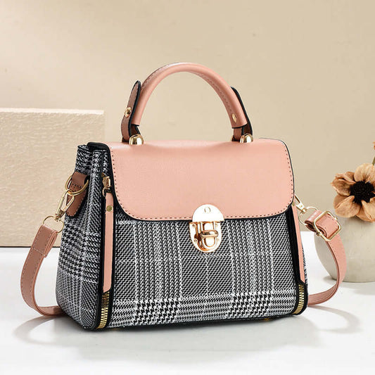 Pink and gray houndstooth envelope shoulder tote with gold clasp and crossbody strap