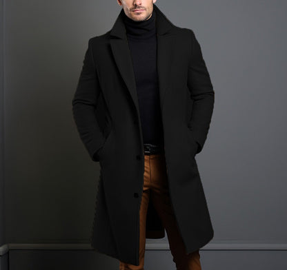 Mid-length trench coat with notched lapels and button front, long sleeves, black.