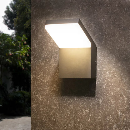 Grey outdoor LED wall sconce with frosted panel and modern L-shaped housing