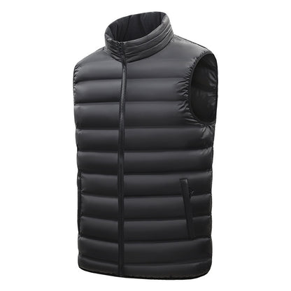 Black puffer vest on a white background