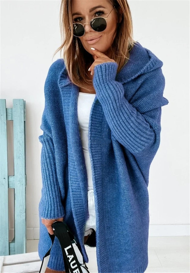 Blue oversized hooded cardigan sweater with batwing sleeves and chunky knit texture