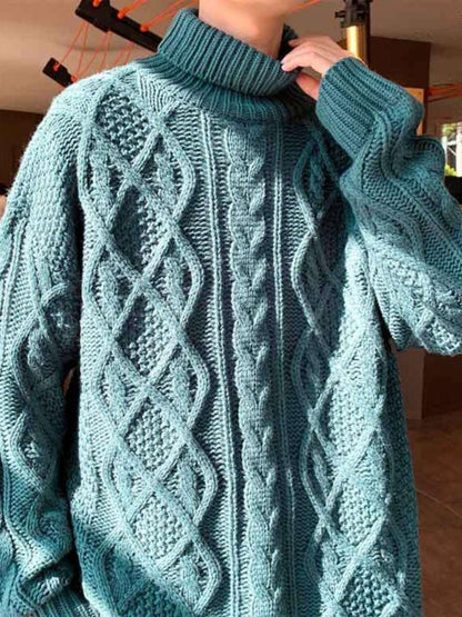 Teal knit turtleneck sweater close-up with cable diamond and raised texture