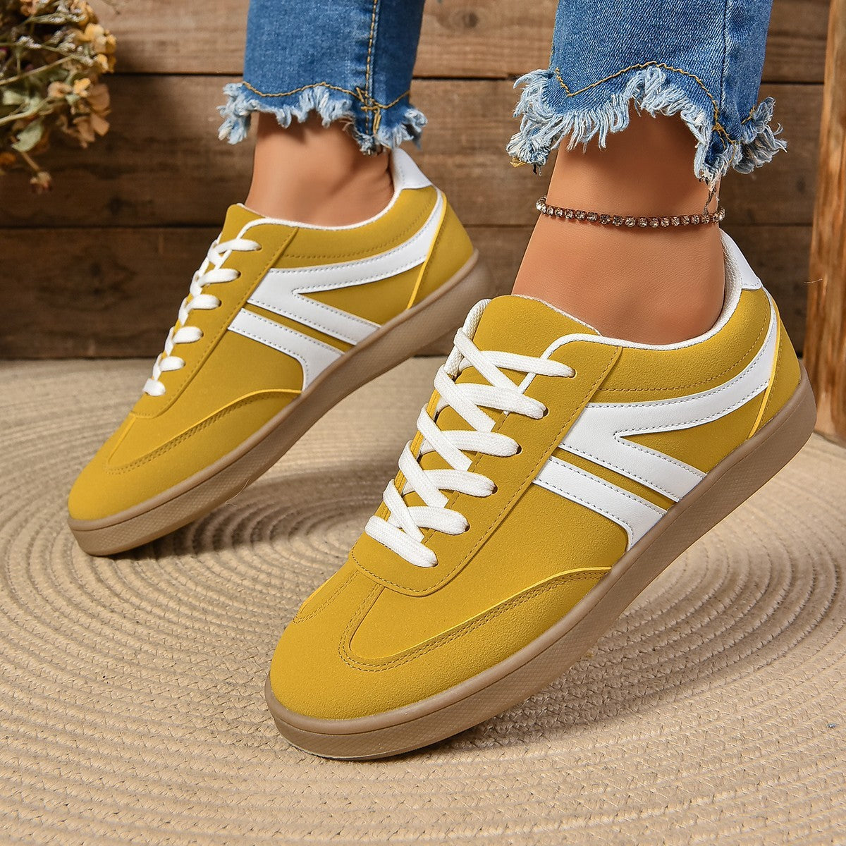 Women's lace-up sneakers, yellow upper with white stripes and gum rubber sole