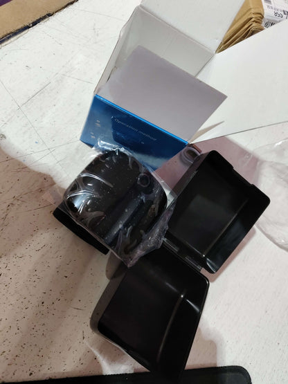 Black wrist blood pressure monitor and USB cable on retail packaging