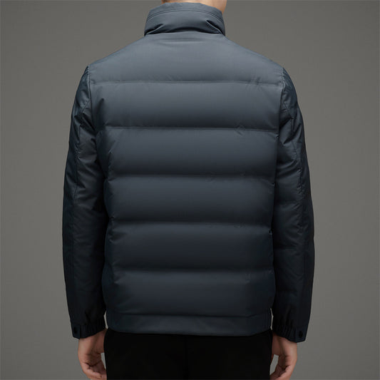 Dark gray puffer jacket on a gray background
