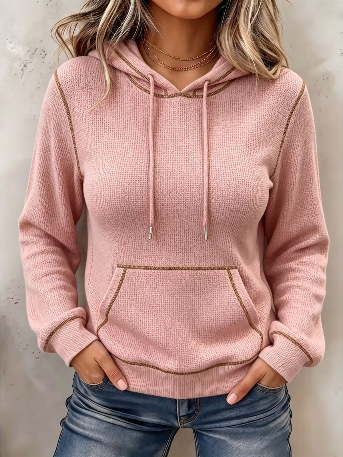 Blush pink long-sleeve hoodie with drawstring hood and front kangaroo pocket