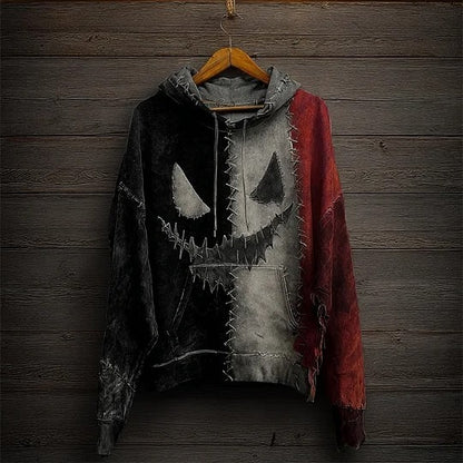 Hoodie with jack-o'-lantern face design on a wooden background