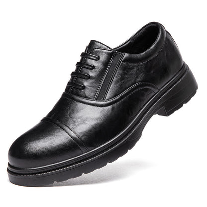 Black leather dress shoe on a white background