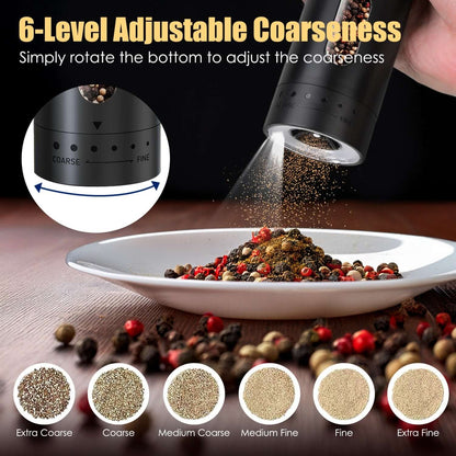 Black rechargeable electric pepper grinder releasing pepper onto a plate, with coarseness dial