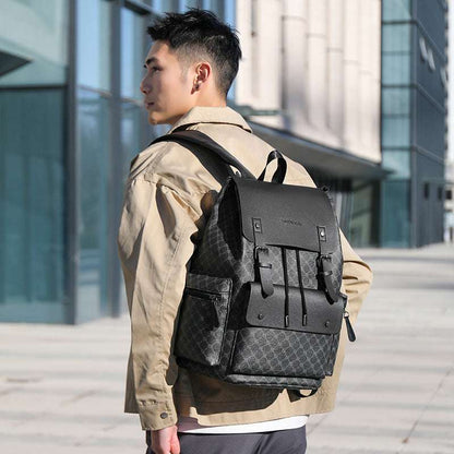Black checkered office backpack worn on back with flap and side buckles