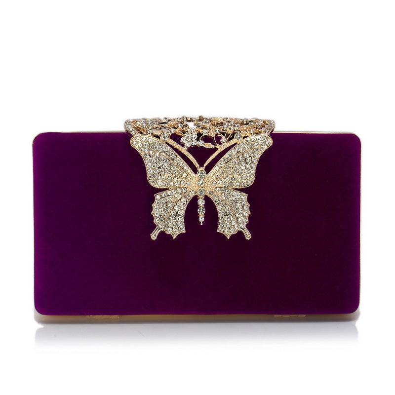 Purple velvet evening clutch with rhinestone butterfly clasp