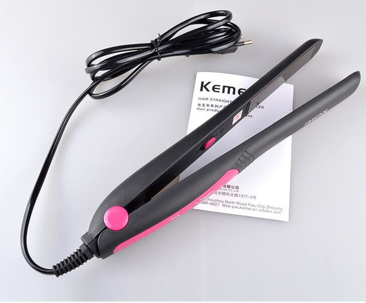 Hair straightener with pink accent on a white background