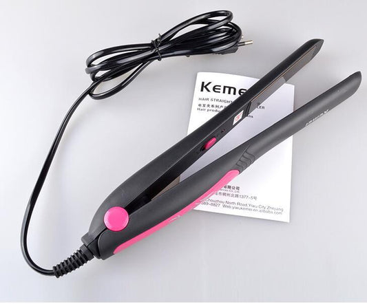 Hair straightener with pink accent on a white background