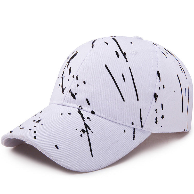 White baseball cap with black graffiti drip print, curved brim, adjustable fit