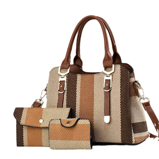 Striped handbag with matching wallet and cardholder on a white background