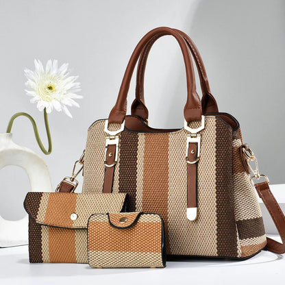 Striped handbag with matching wallet and cardholder on a light background