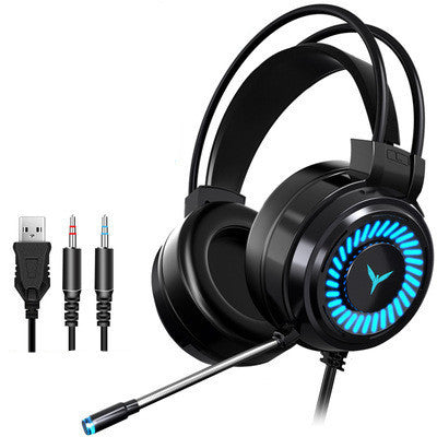 A pair of black King G60 gaming headphones with blue LED lights on the ear cups, resting on a laptop.