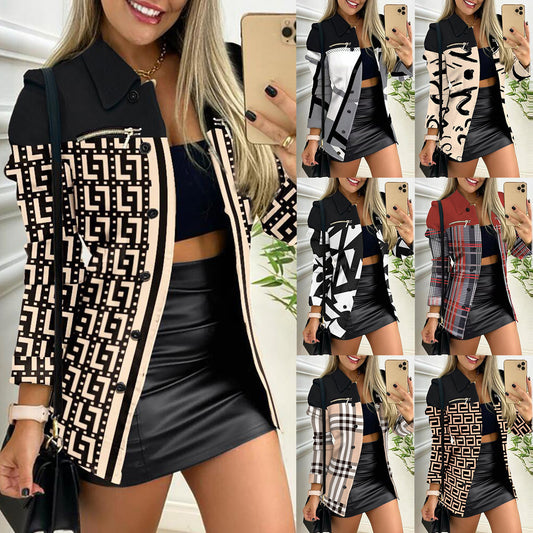 Woman wearing a patterned jacket and black skirt 