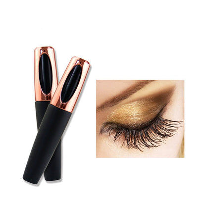 Two black mascara tubes with rose gold tips and an inset of a styled eye with gold mascara.