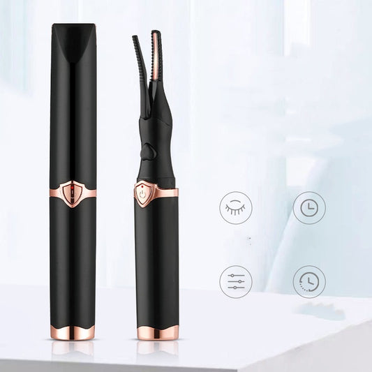 Black and rose gold eyelash curler on a white background