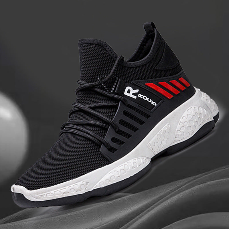 Black and white athletic shoe with red accents on a gray background
