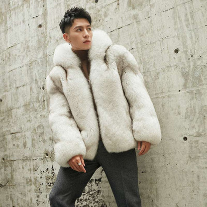 Person wearing a white fur coat against a textured wall