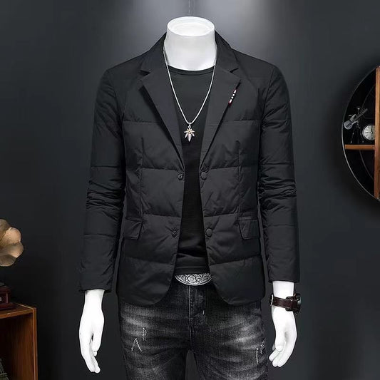 Mannequin wearing a black puffer jacket and jeans against a dark background