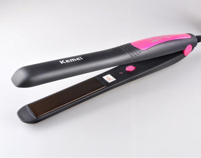 Hair straightener with Kemei branding on a white background