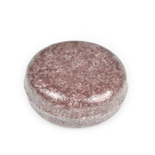 Round pinkish stone on a white background