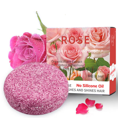 Pink shampoo bar with rose-themed packaging on a white background