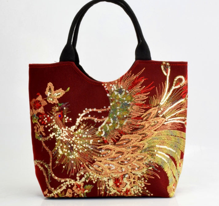 Decorative tote bag with embroidered design on a white background