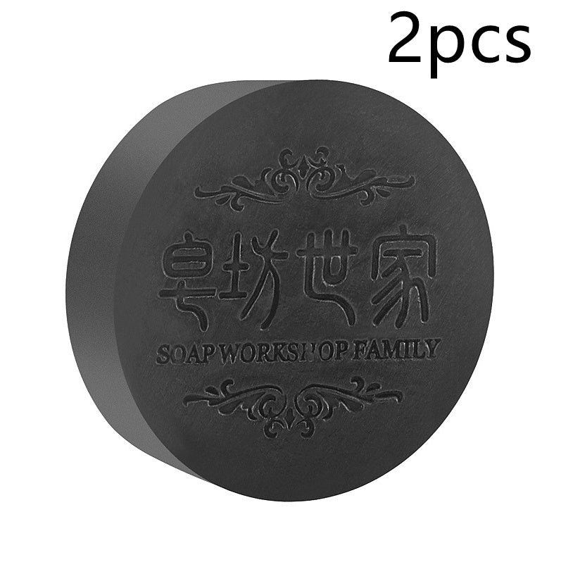 Black soap bar with 'Soap Workshop Family' branding on a white background