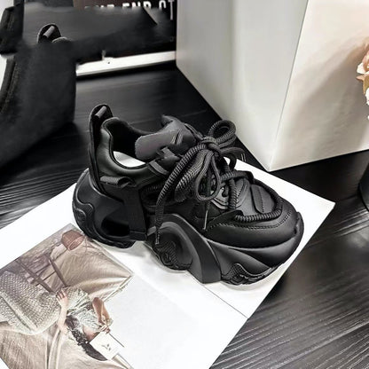 A pair of women's sneakers with thick soles and lace-up closure, displayed in a store setting, with one sneaker in brown color and the other in black color.