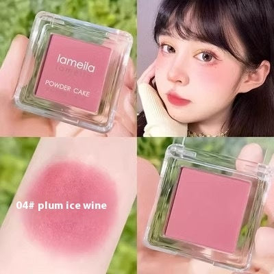Collage of a pink powder cake with 'lamelia' branding, applied to skin and swatched.