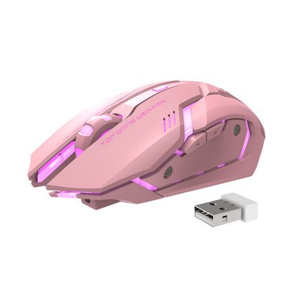 Wireless gaming mouse with blue LED lights, placed on a laptop, with a charging USB dongle beside it.
