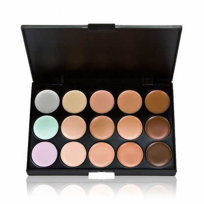Makeup palette with various shades of cream in a black case on a white background