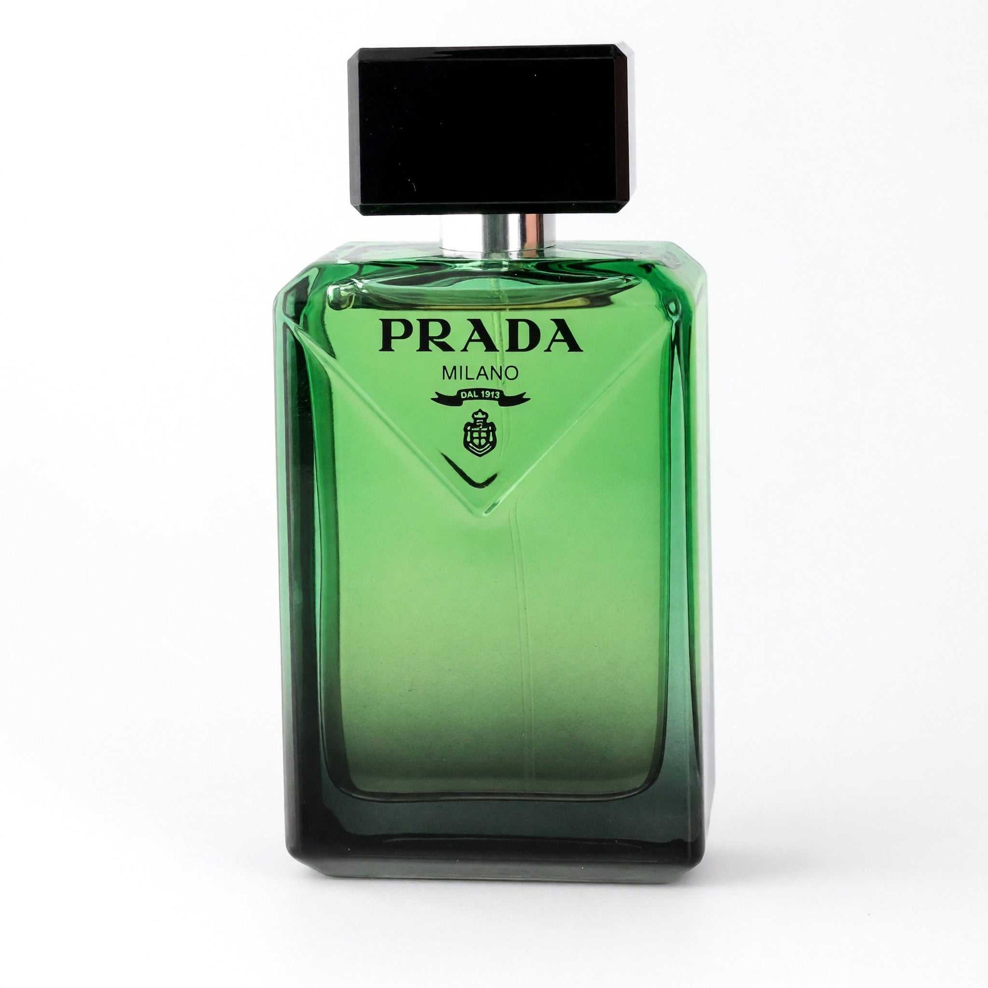 Men's EDP tester bottle with green glass, black cap, and PRADA Milano logo