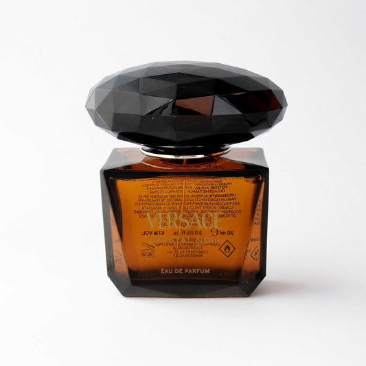 Versace Crystal Noir EDP spray bottle, dark faceted cap, amber label